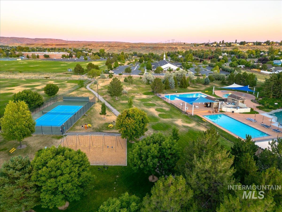 Aerial view at dusk of view of pool area
