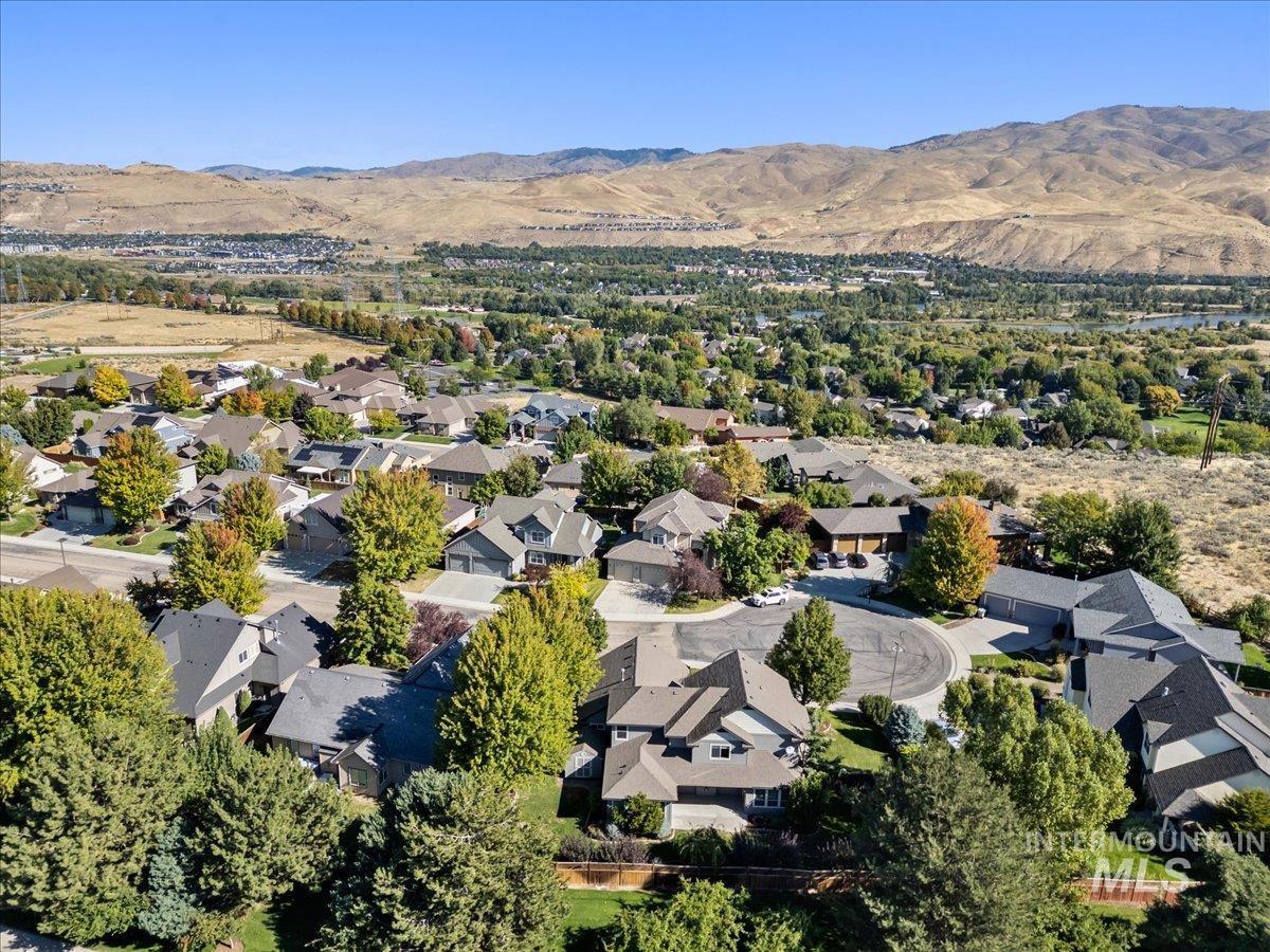 Aerial perspective of suburban area with a mountain backdrop