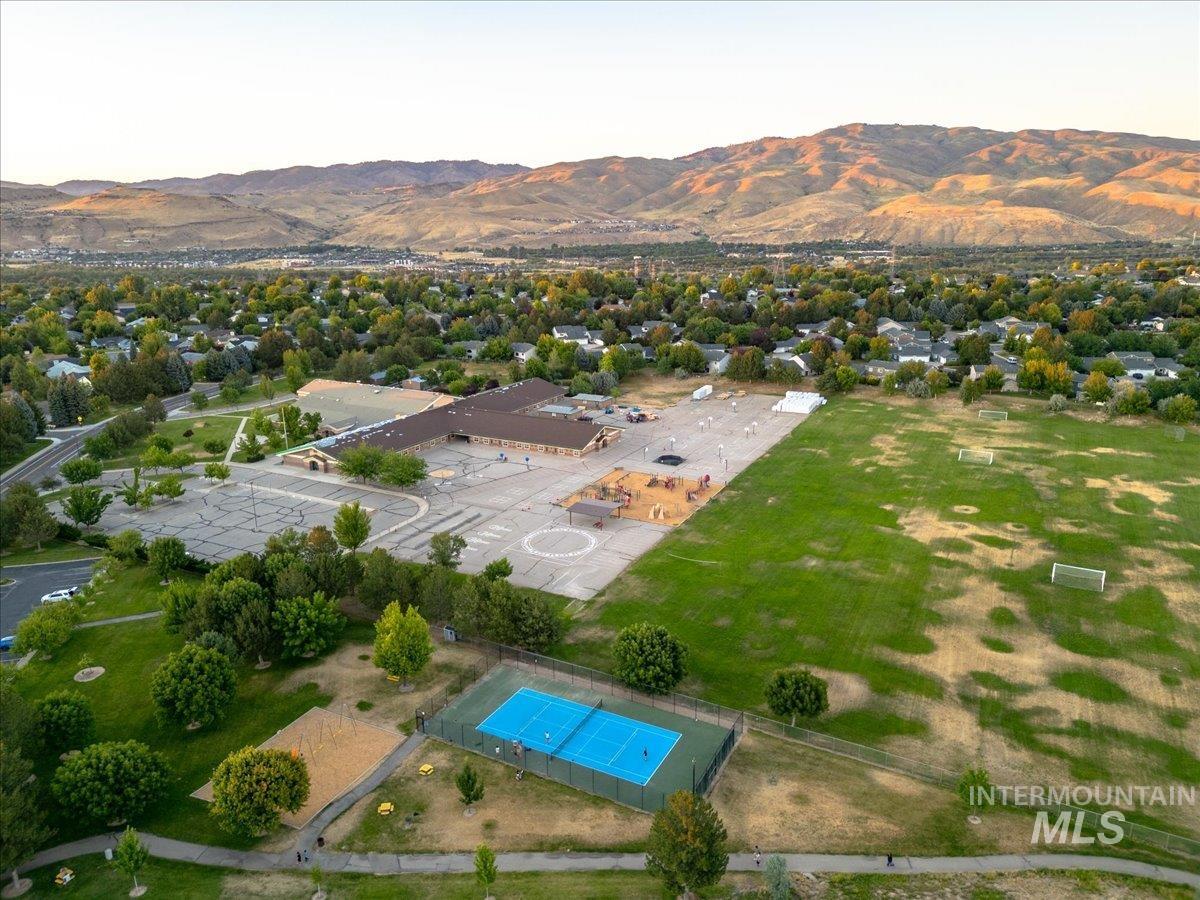 Aerial overview of property's location with a mountain backdrop