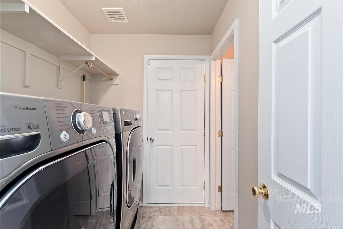 Washroom featuring washing machine and clothes dryer