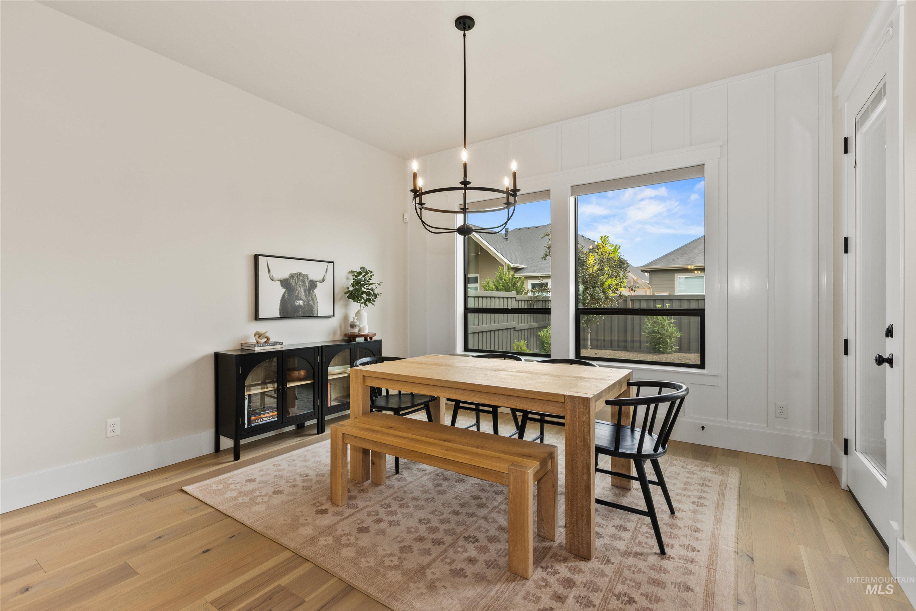 Dining space featuring a chandelier and light wood-style floors