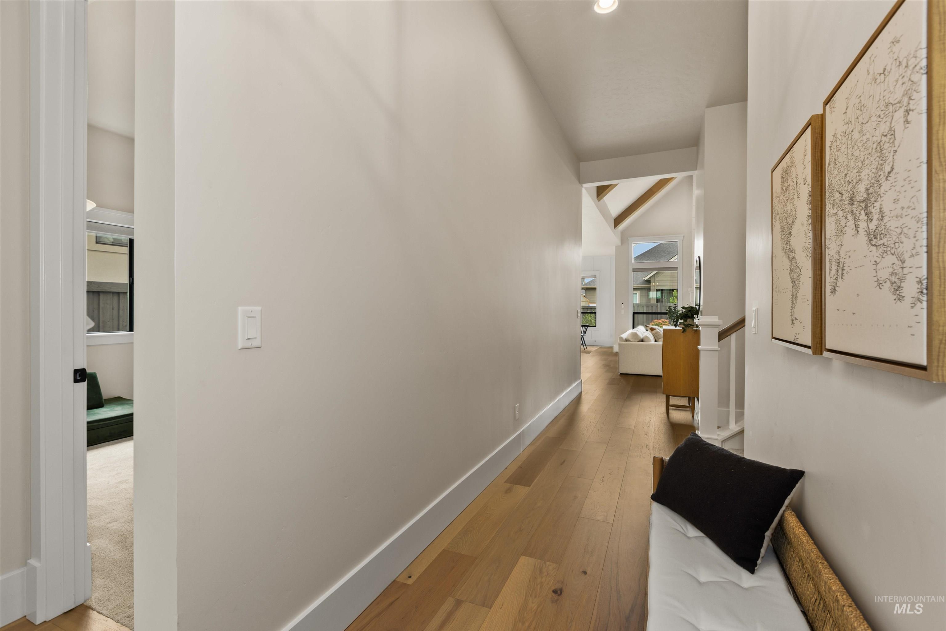 Hallway featuring hardwood / wood-style flooring and recessed lighting