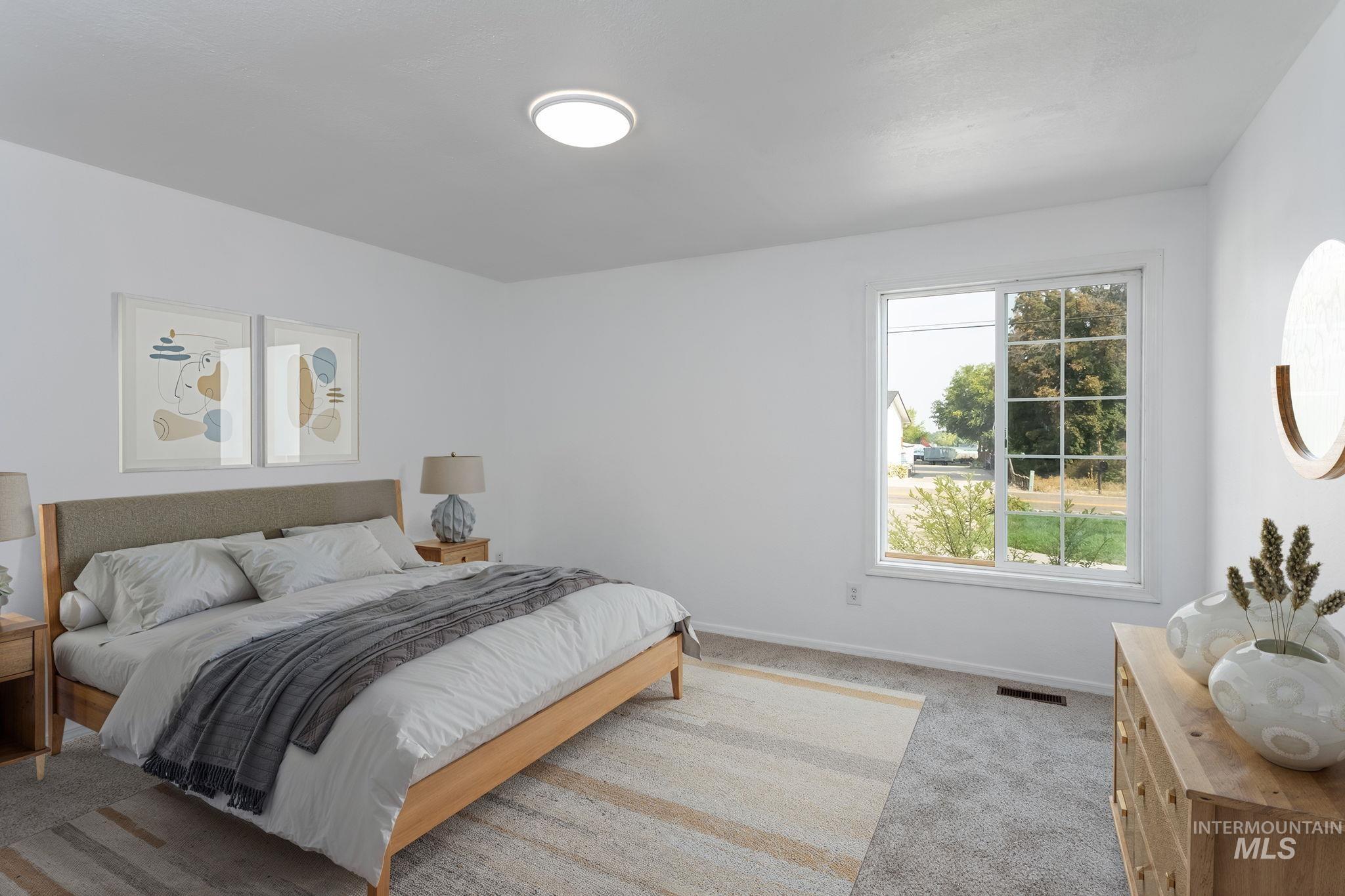 Bedroom with carpet and baseboards