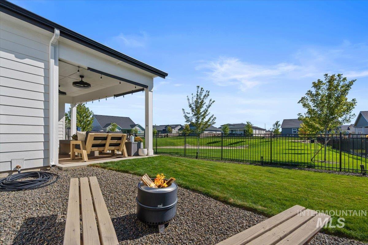 View of yard featuring a patio and a residential view