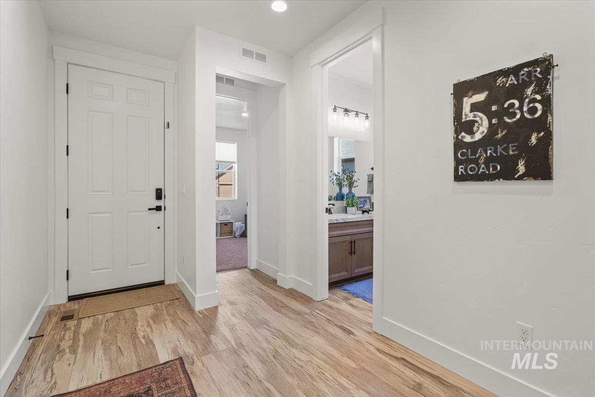 Entrance foyer featuring light wood-type flooring and recessed lighting