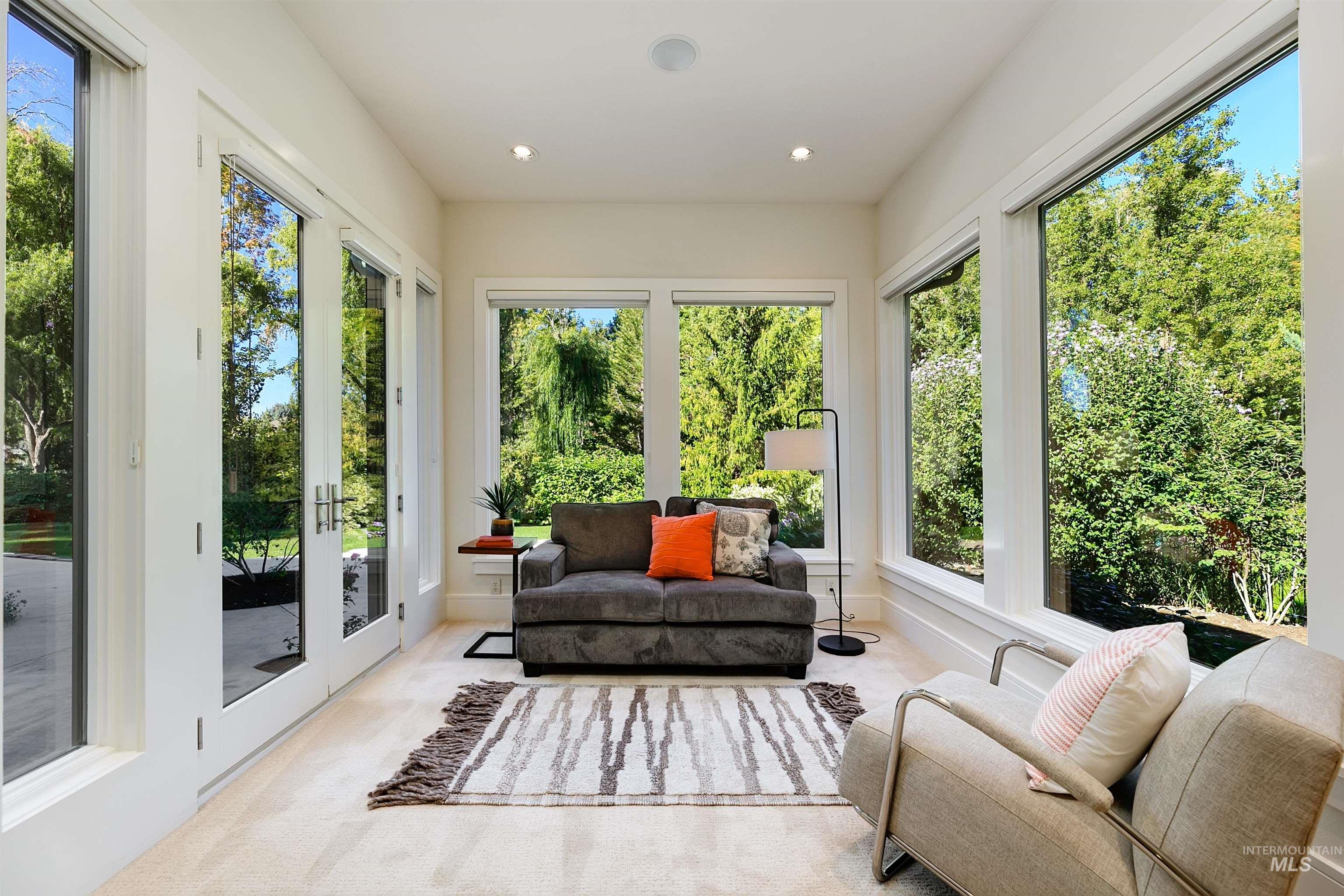 Sunroom / solarium with french doors, recessed lighting, and carpet flooring