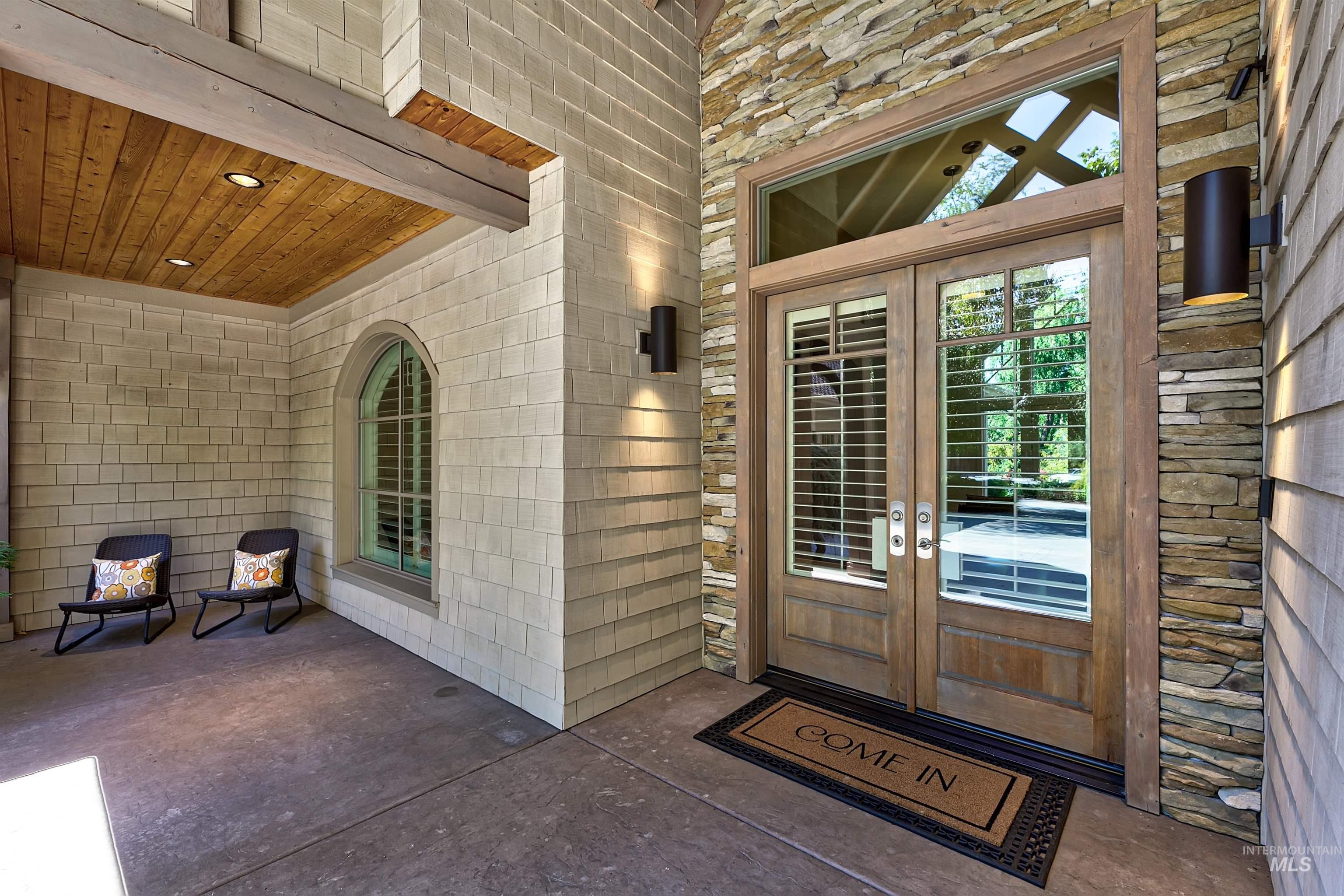 Doorway to property with french doors and a patio