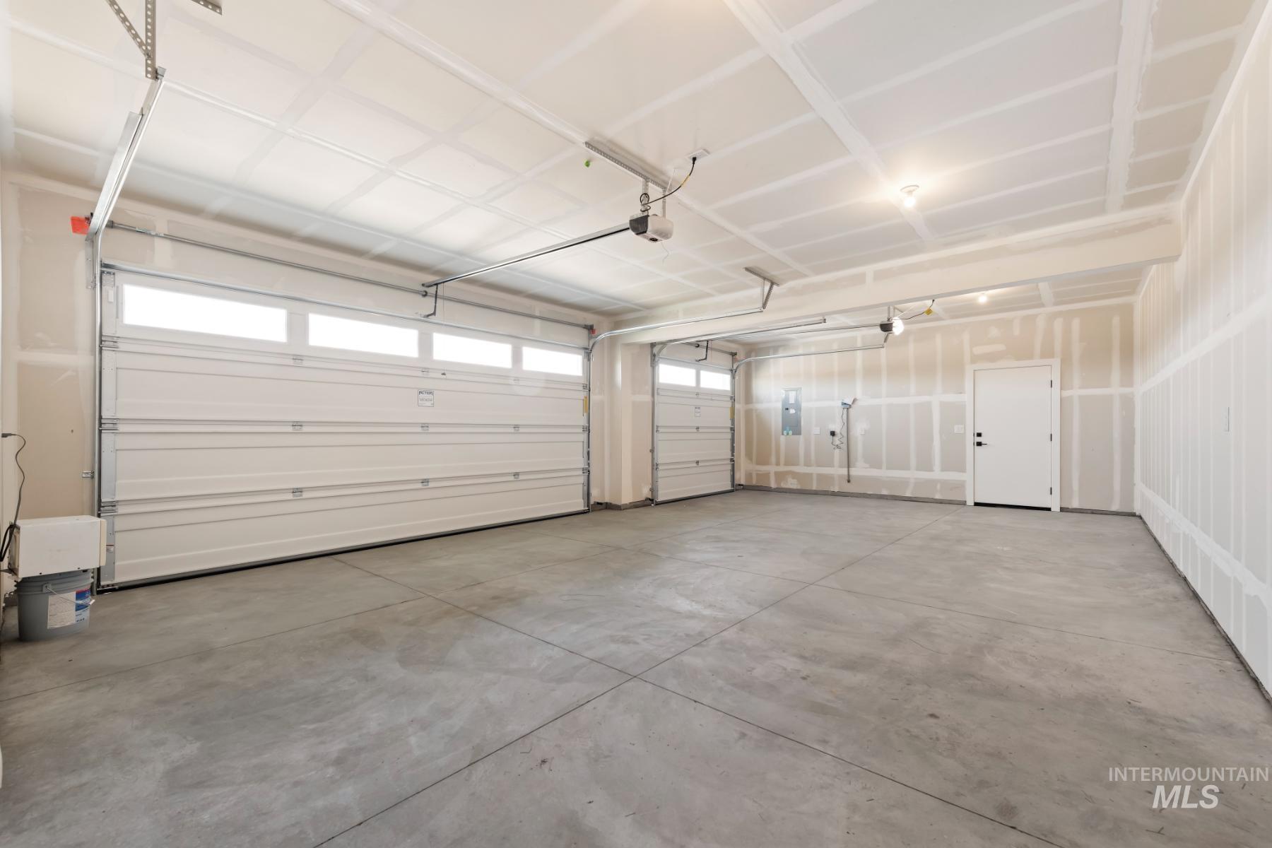 Garage featuring electric panel