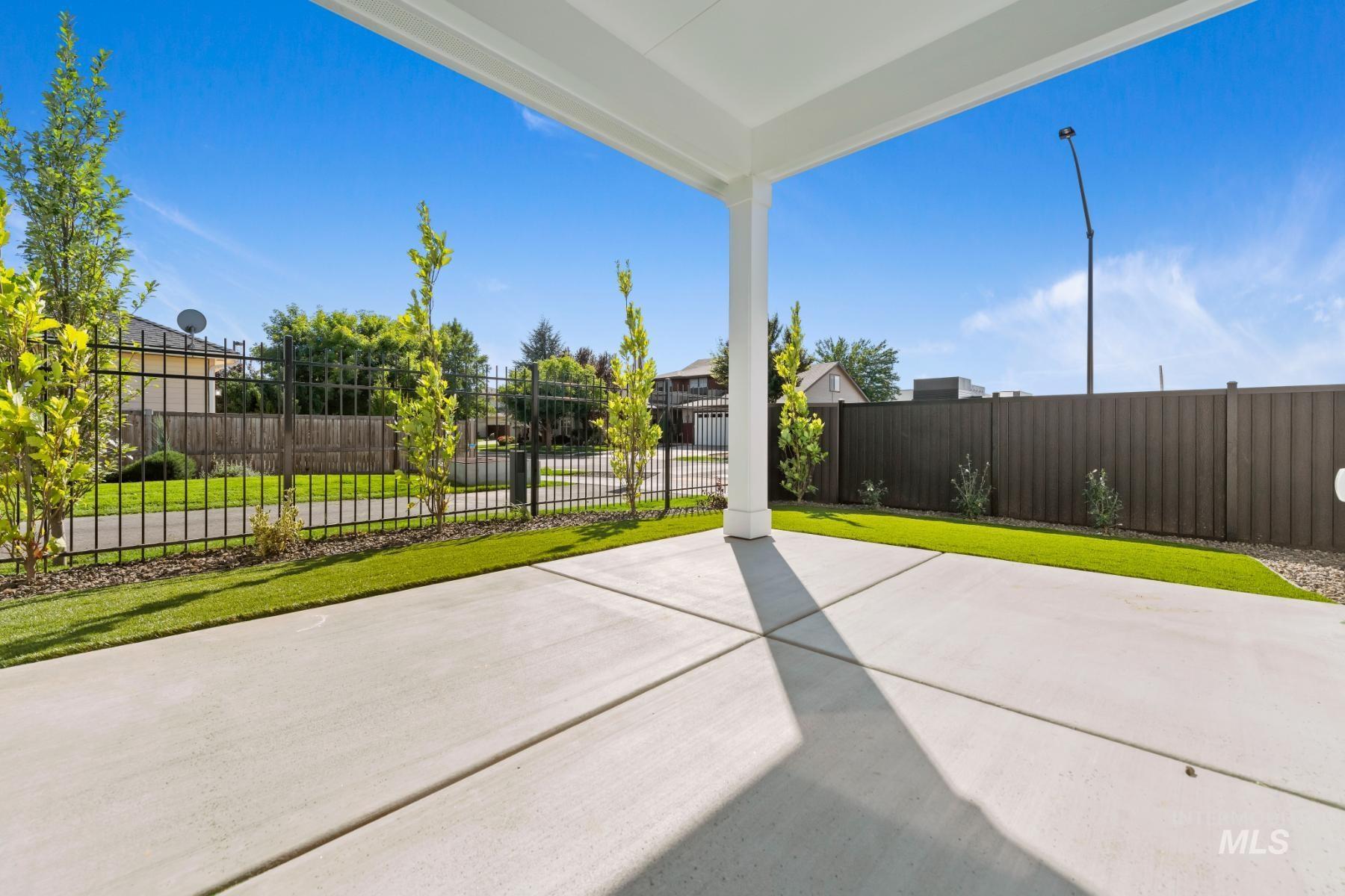 Fenced backyard featuring a patio