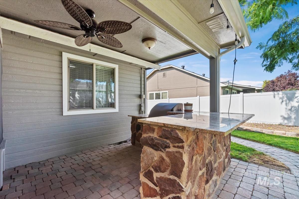 View of patio / terrace featuring an outdoor kitchen and ceiling fan