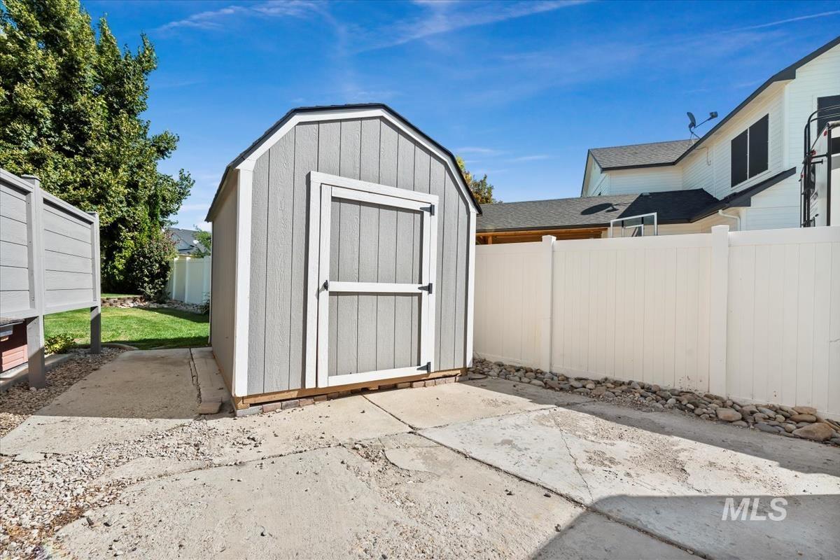 View of shed featuring a fenced backyard