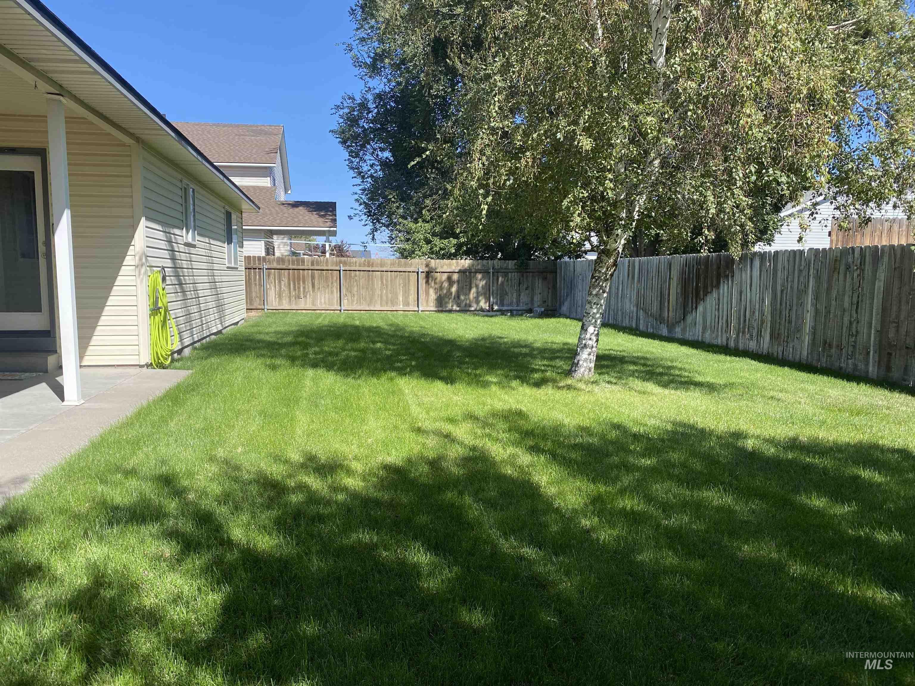 View of fenced backyard