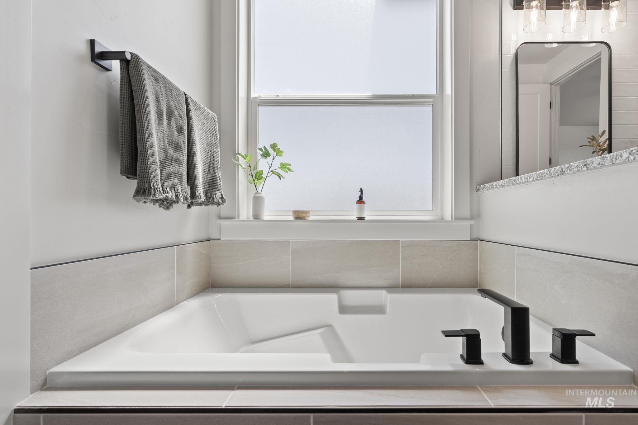 Full bath featuring a bath
