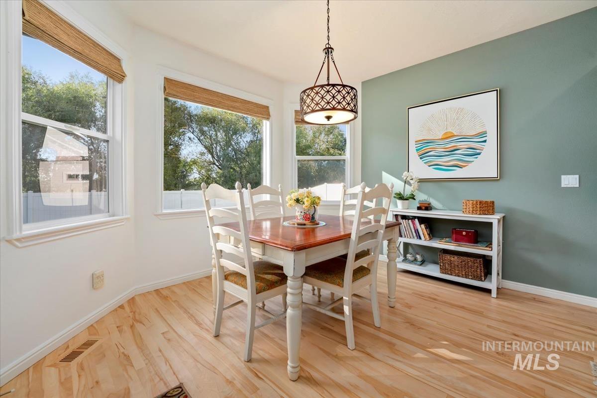 Dining room featuring baseboards and light wood-type flooring
