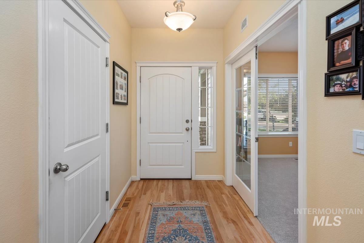 Doorway featuring wood finished floors