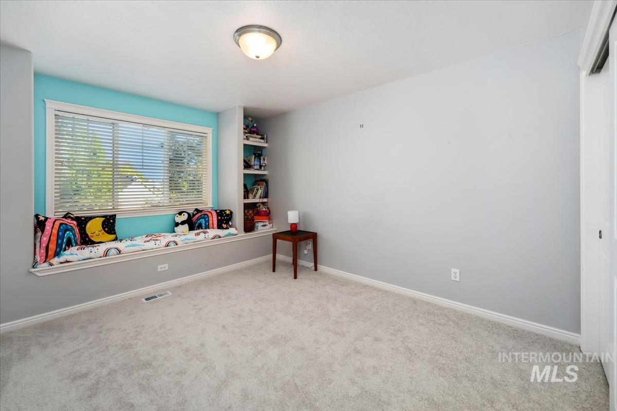 Playroom with carpet flooring and baseboards