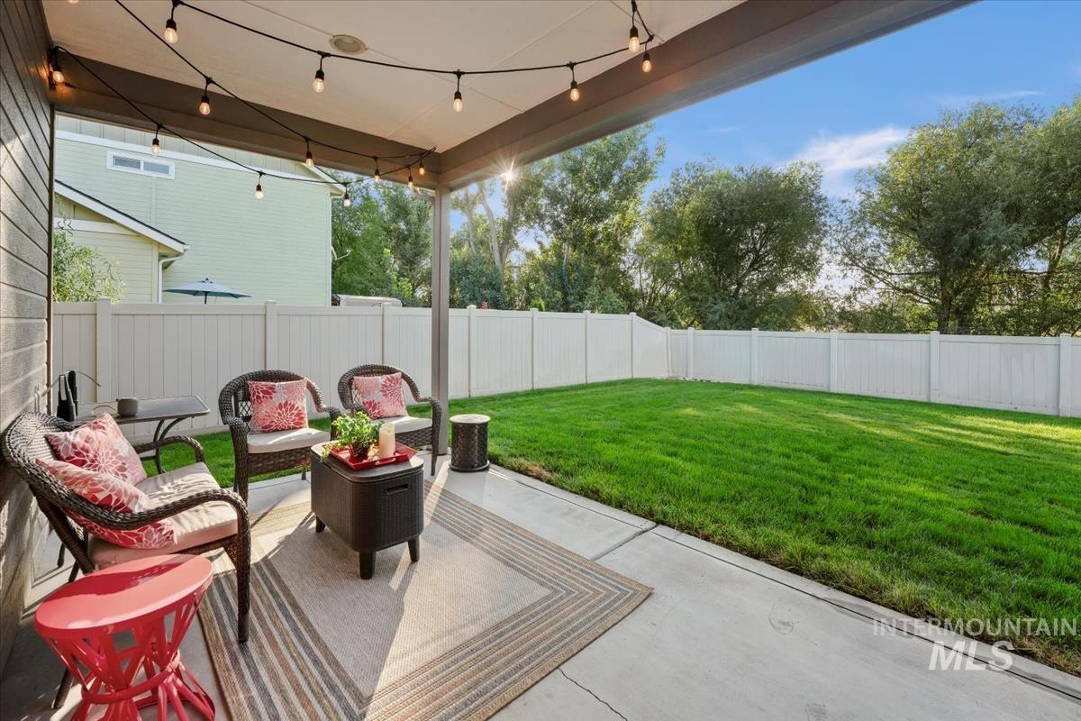 Fenced backyard with a patio area