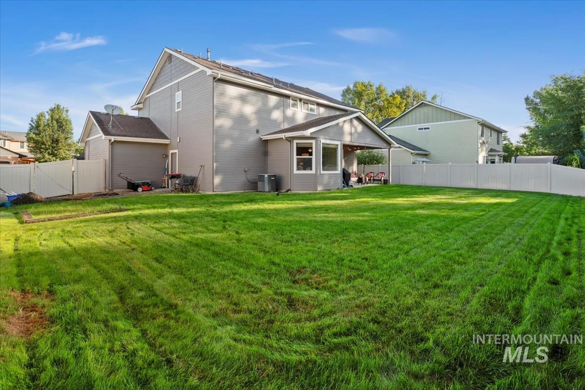 Rear view of property with a patio