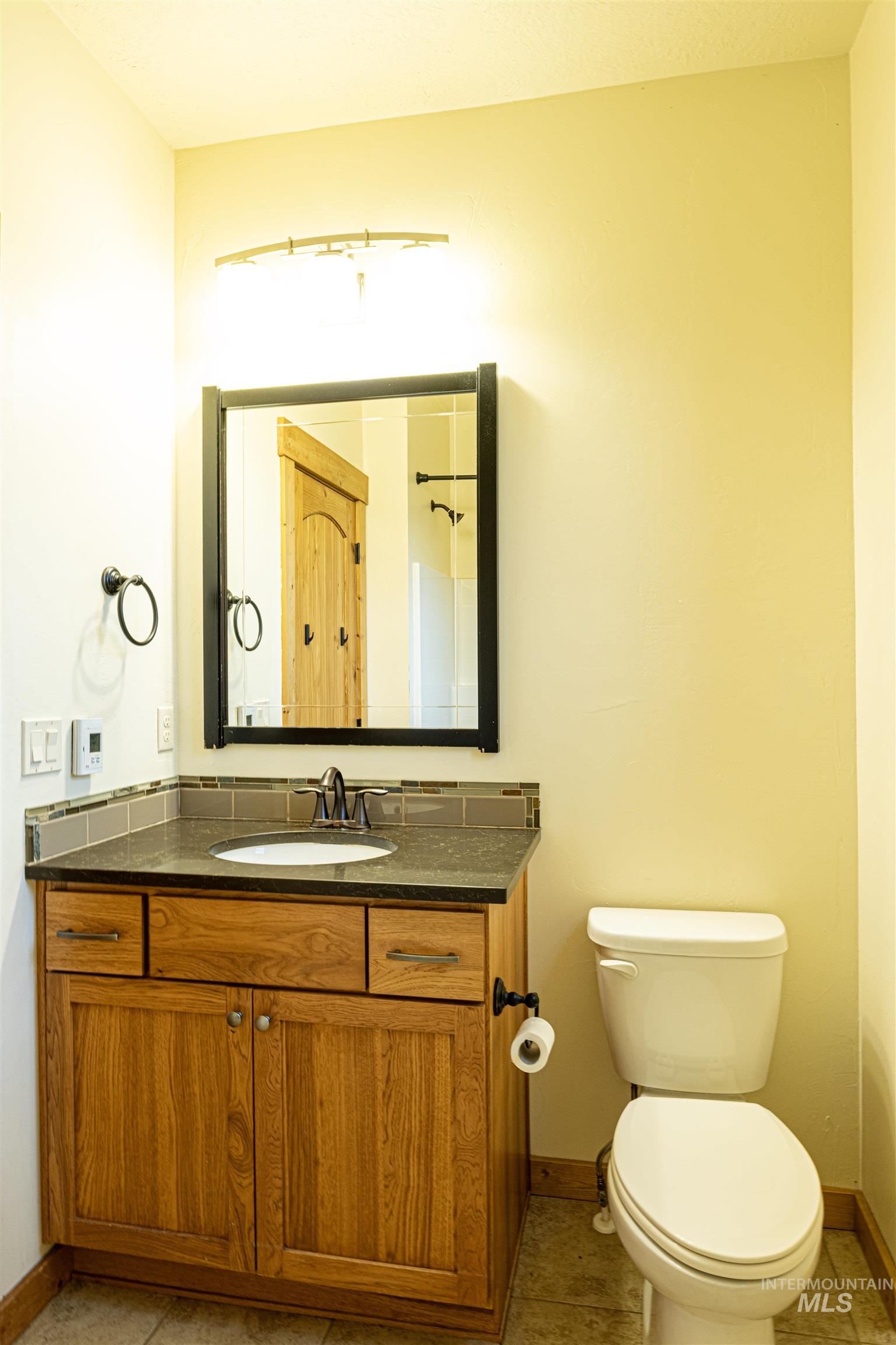 Bathroom featuring vanity and light tile patterned floors