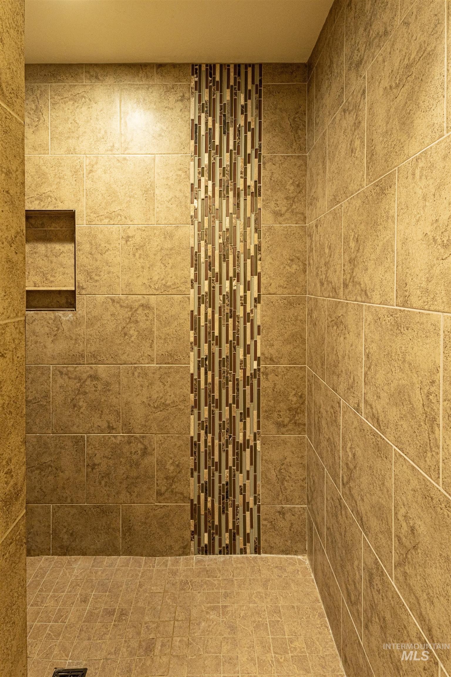 Bathroom with a tile shower