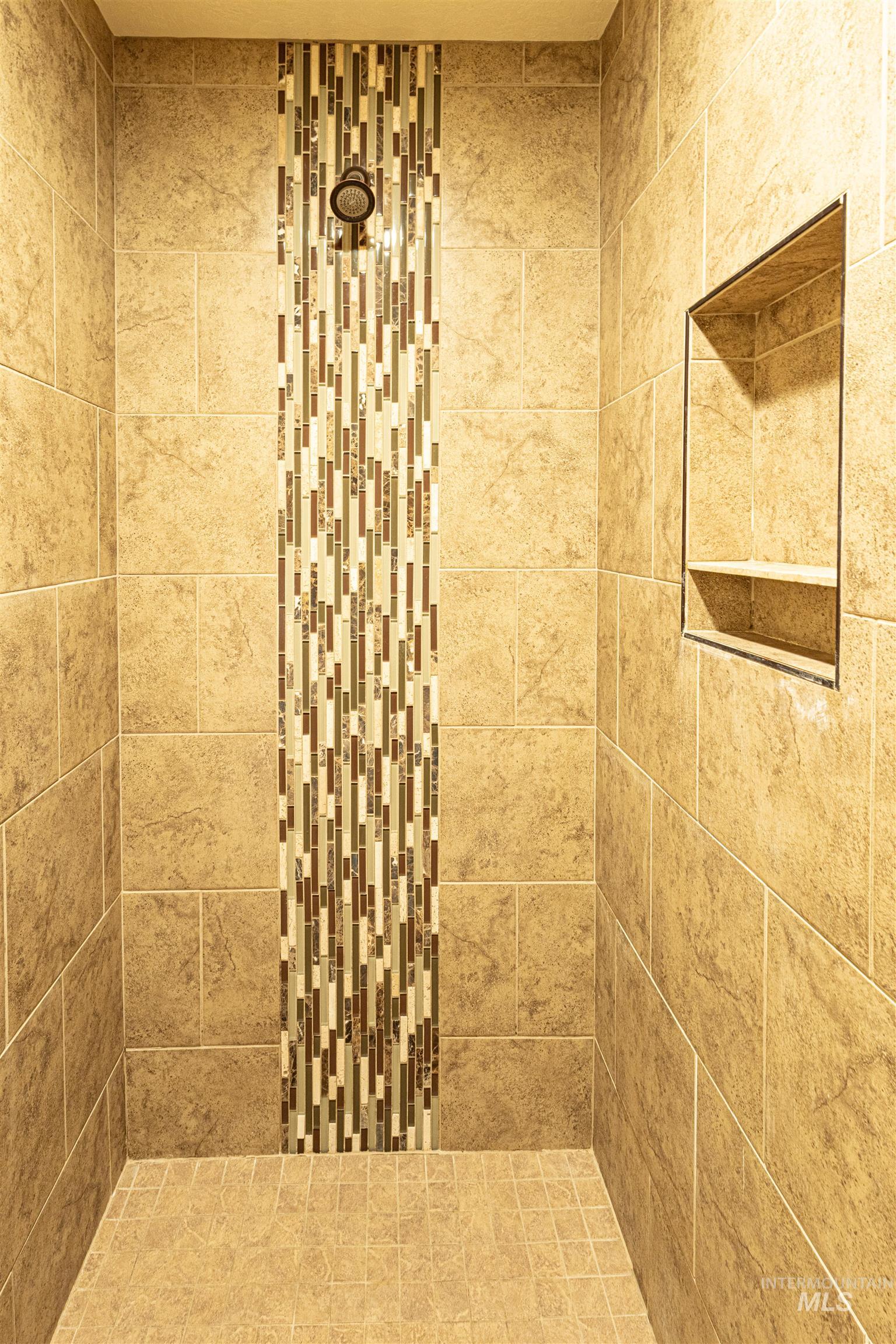 Full bathroom with a tile shower