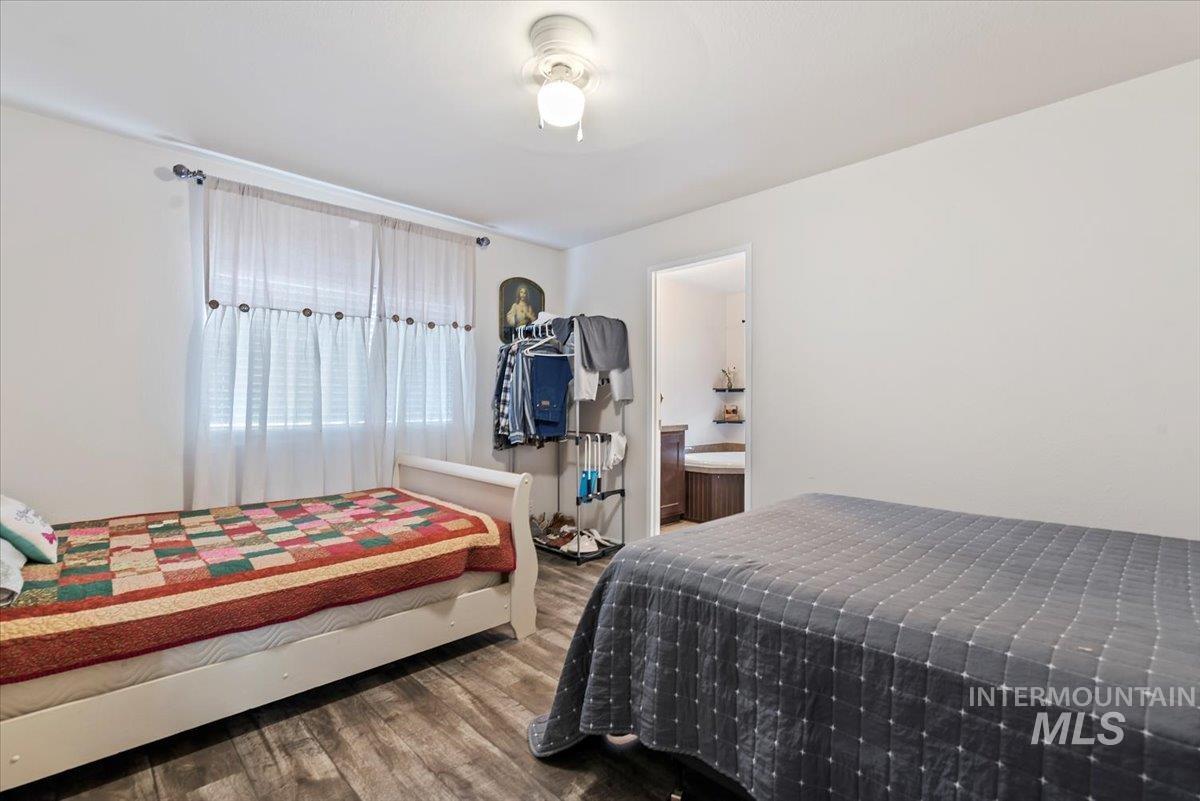 Bedroom with wood finished floors