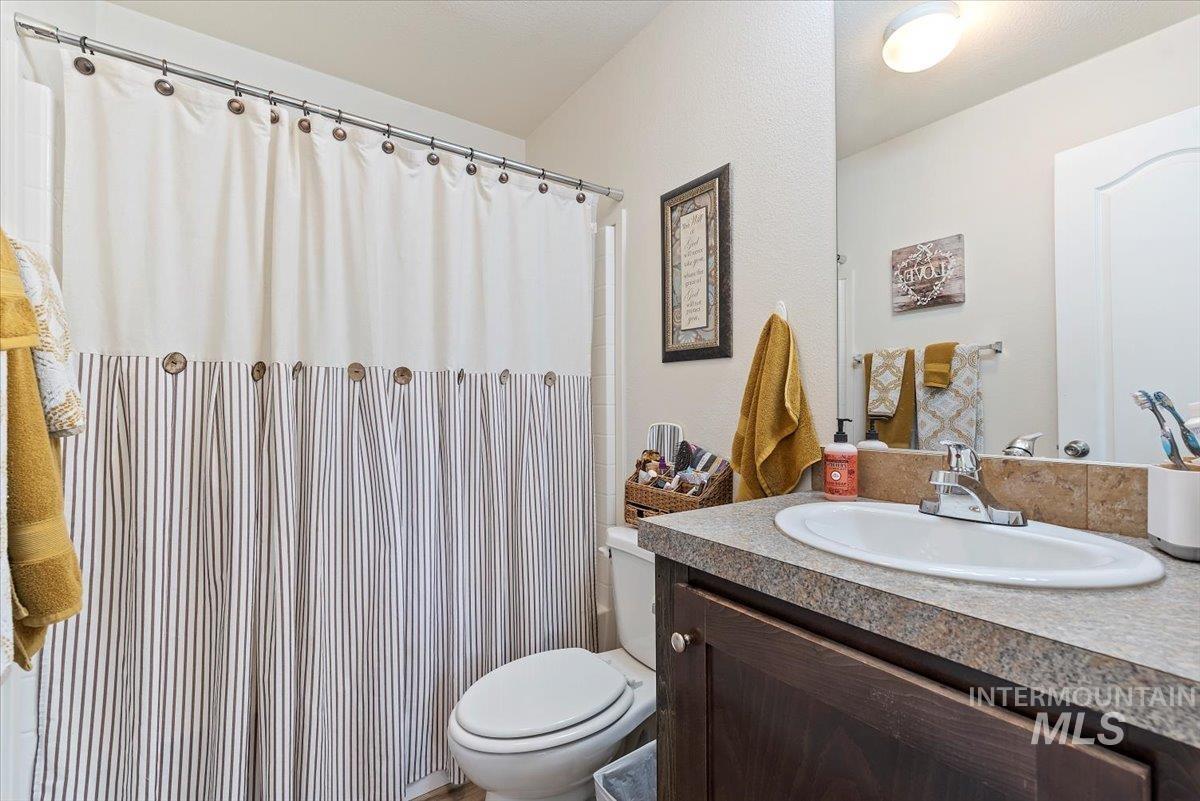Bathroom featuring vanity and a shower with curtain