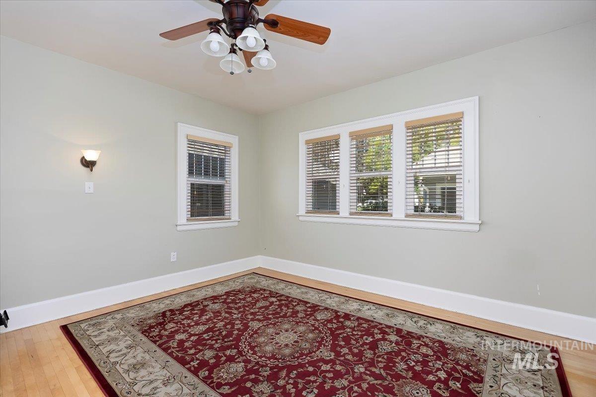 Spare room featuring light wood finished floors and a ceiling fan