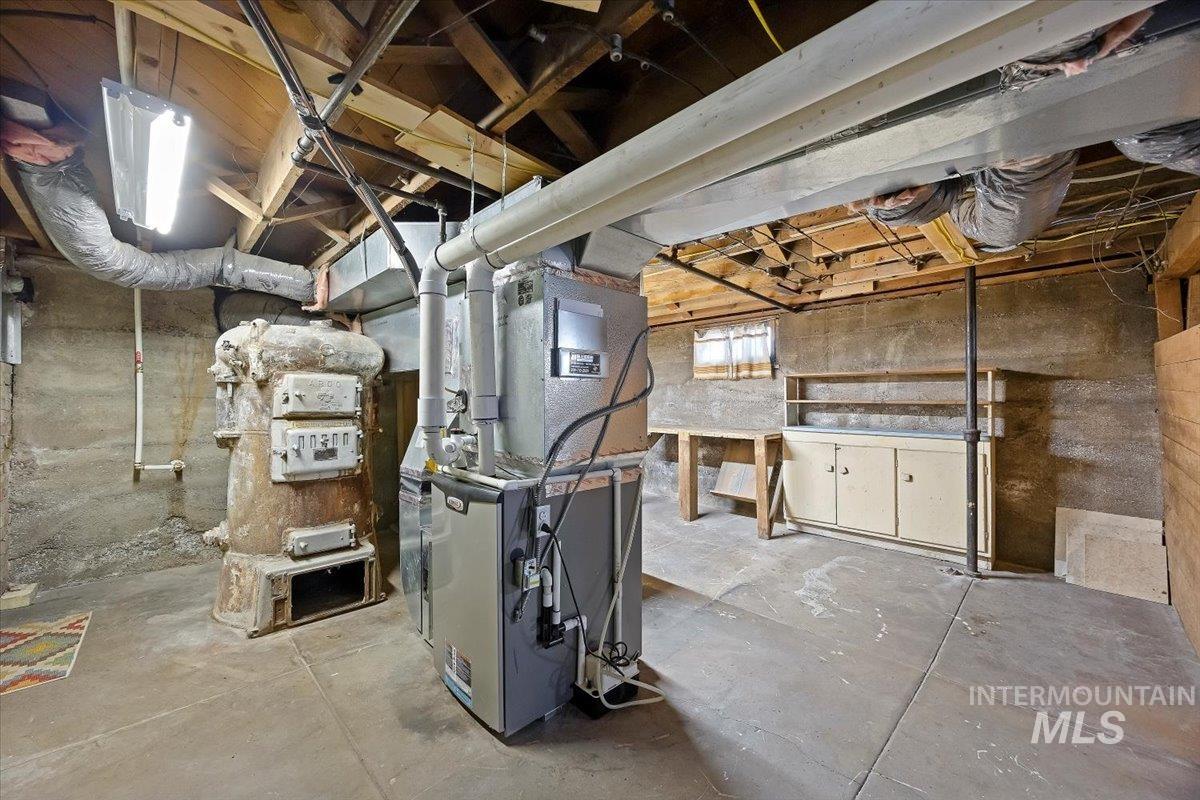 Unfinished basement with heating unit