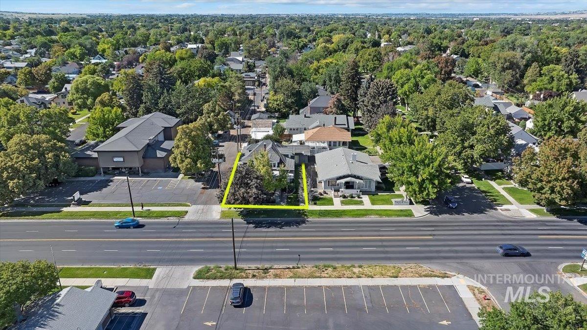 Aerial perspective of suburban area featuring property boundaries highlighted