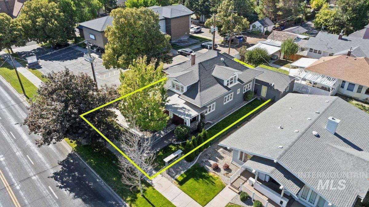 Aerial view of residential area with property boundaries highlighted
