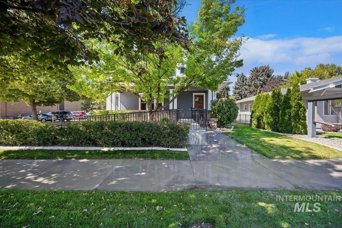 Obstructed view of property with a fenced front yard