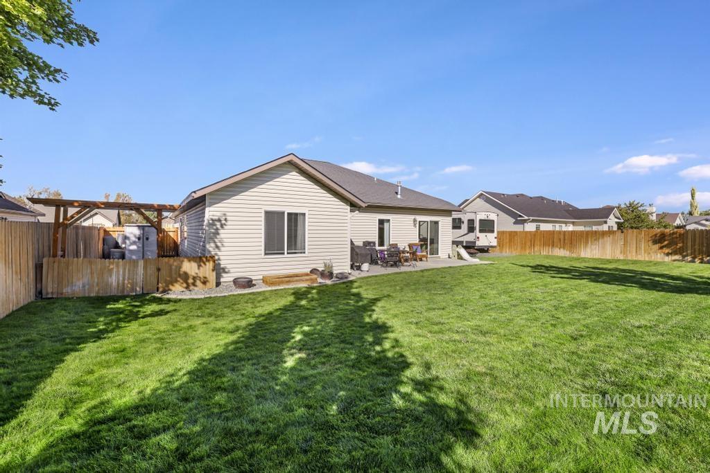 Back of property with a patio and a fenced backyard