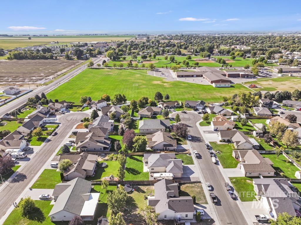 Aerial overview of property's location with nearby suburban area