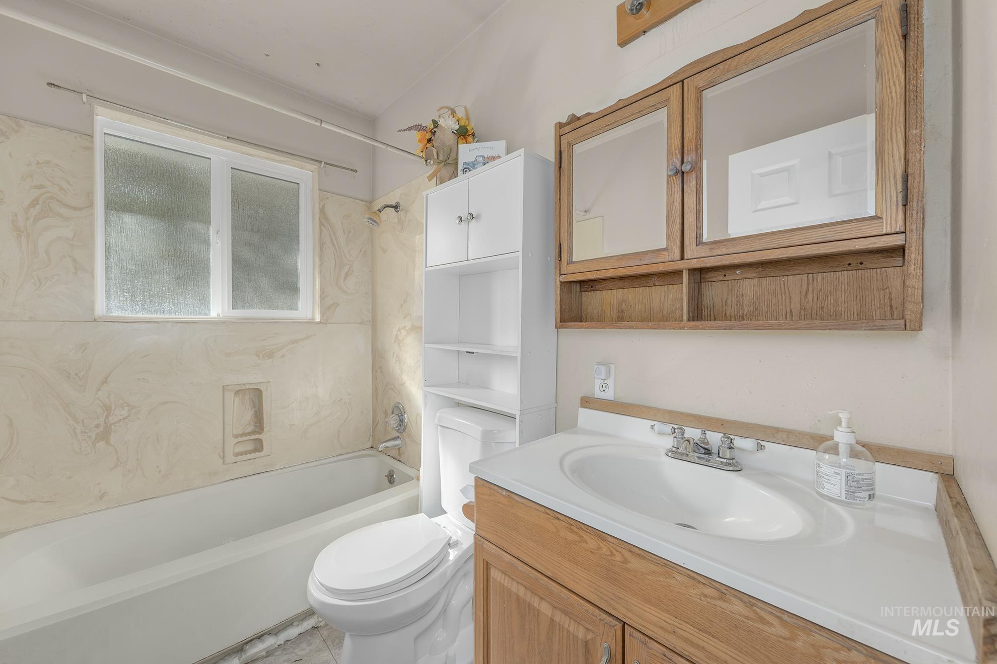 Full bath with shower / tub combination and vanity