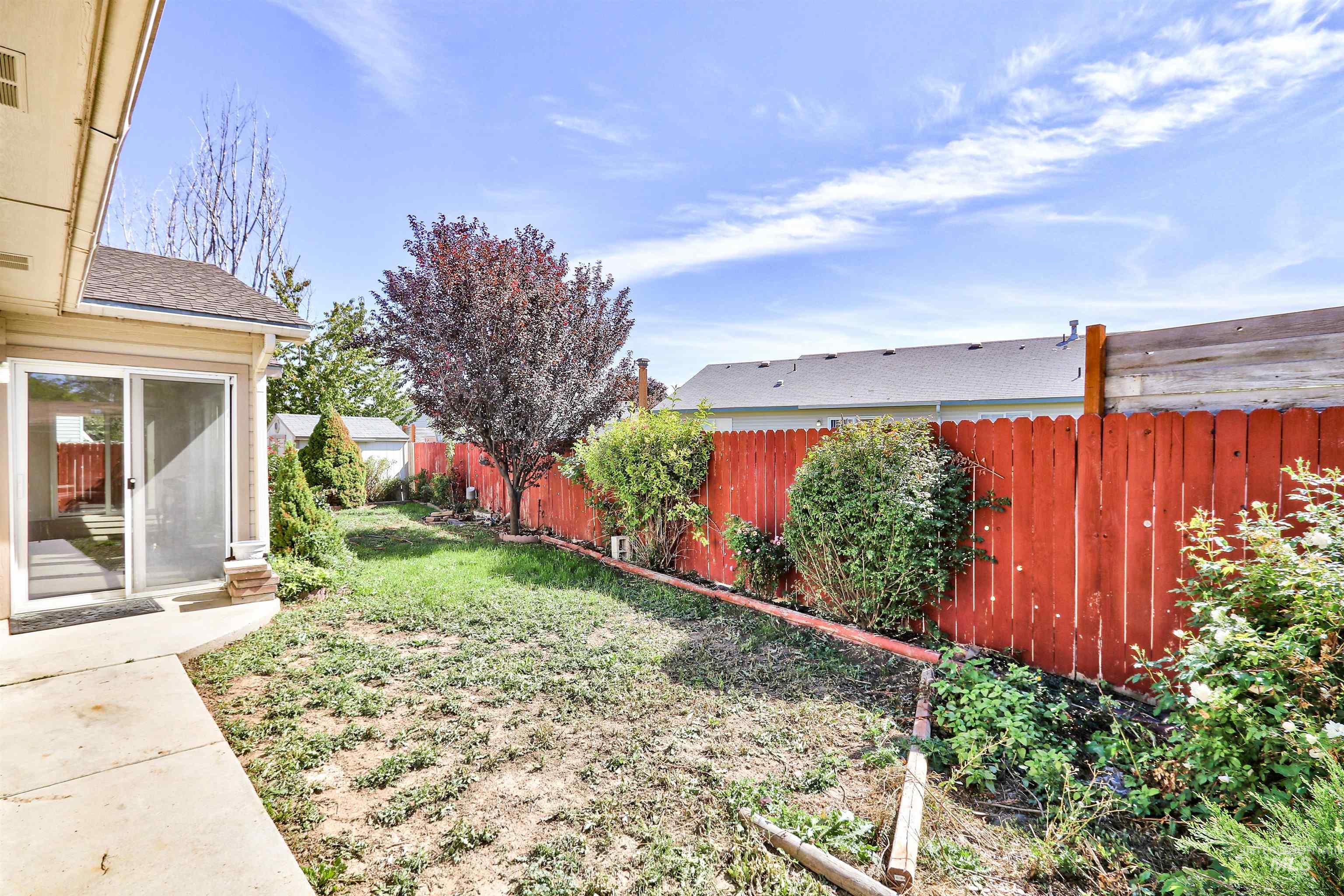 View of fenced backyard