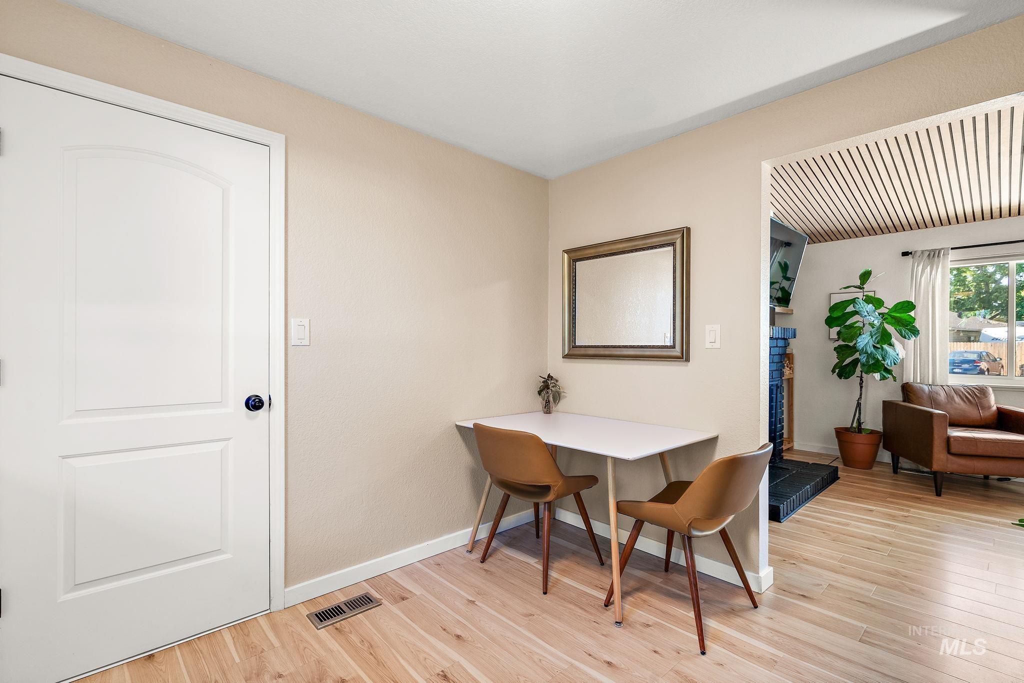 Dining room featuring light wood finished floors and baseboards