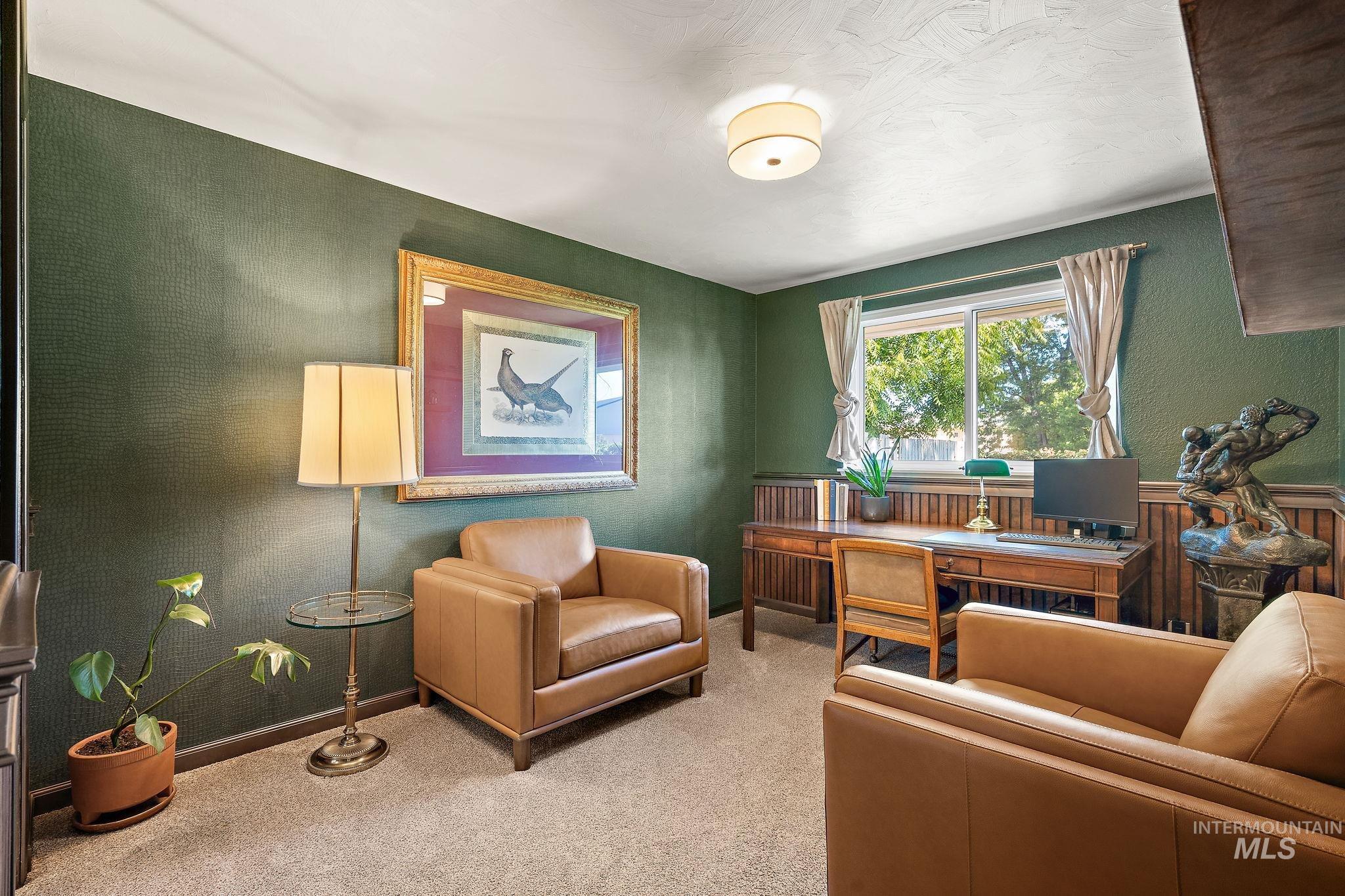 Carpeted office featuring baseboards