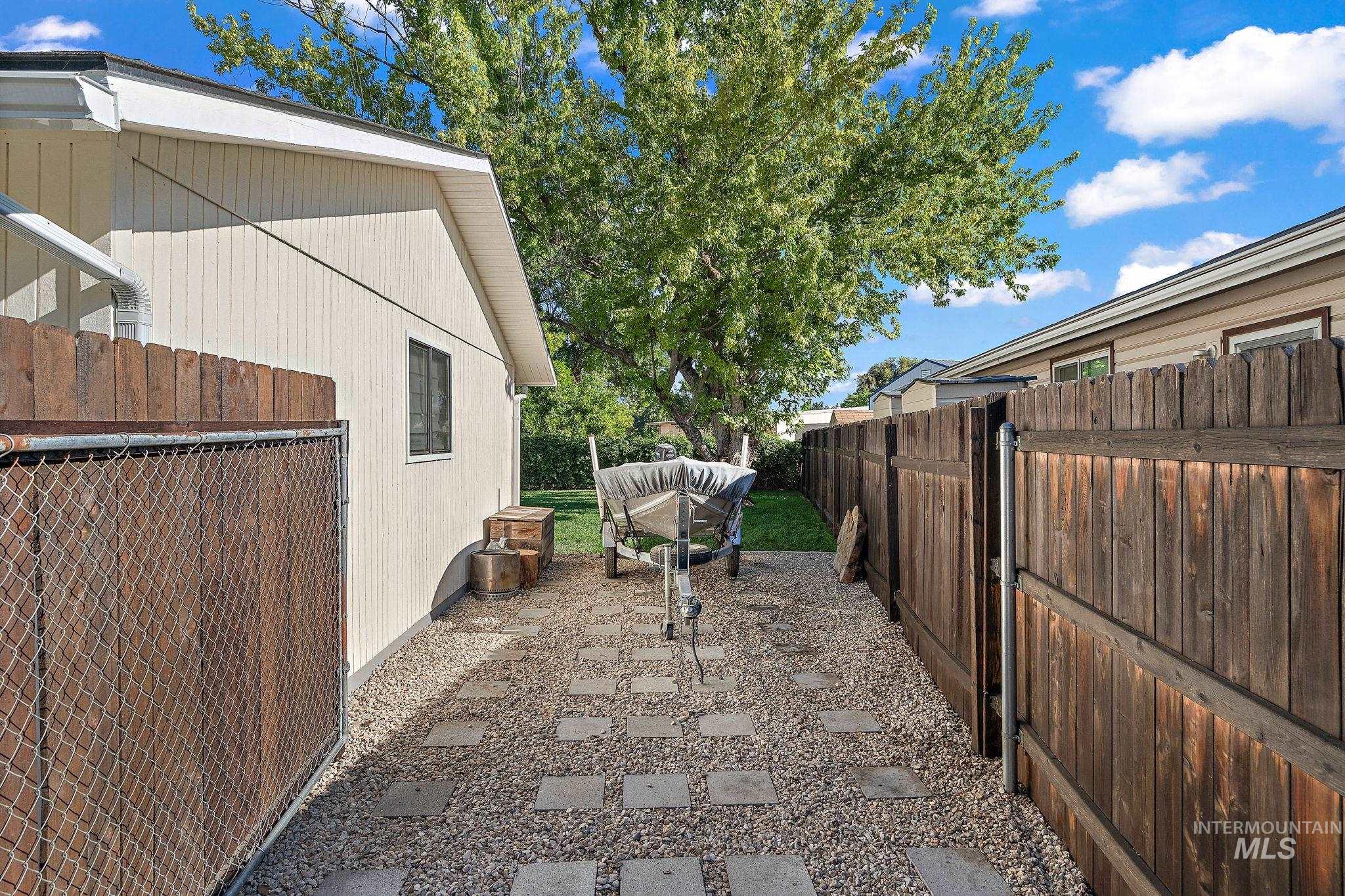 View of side of property with a patio