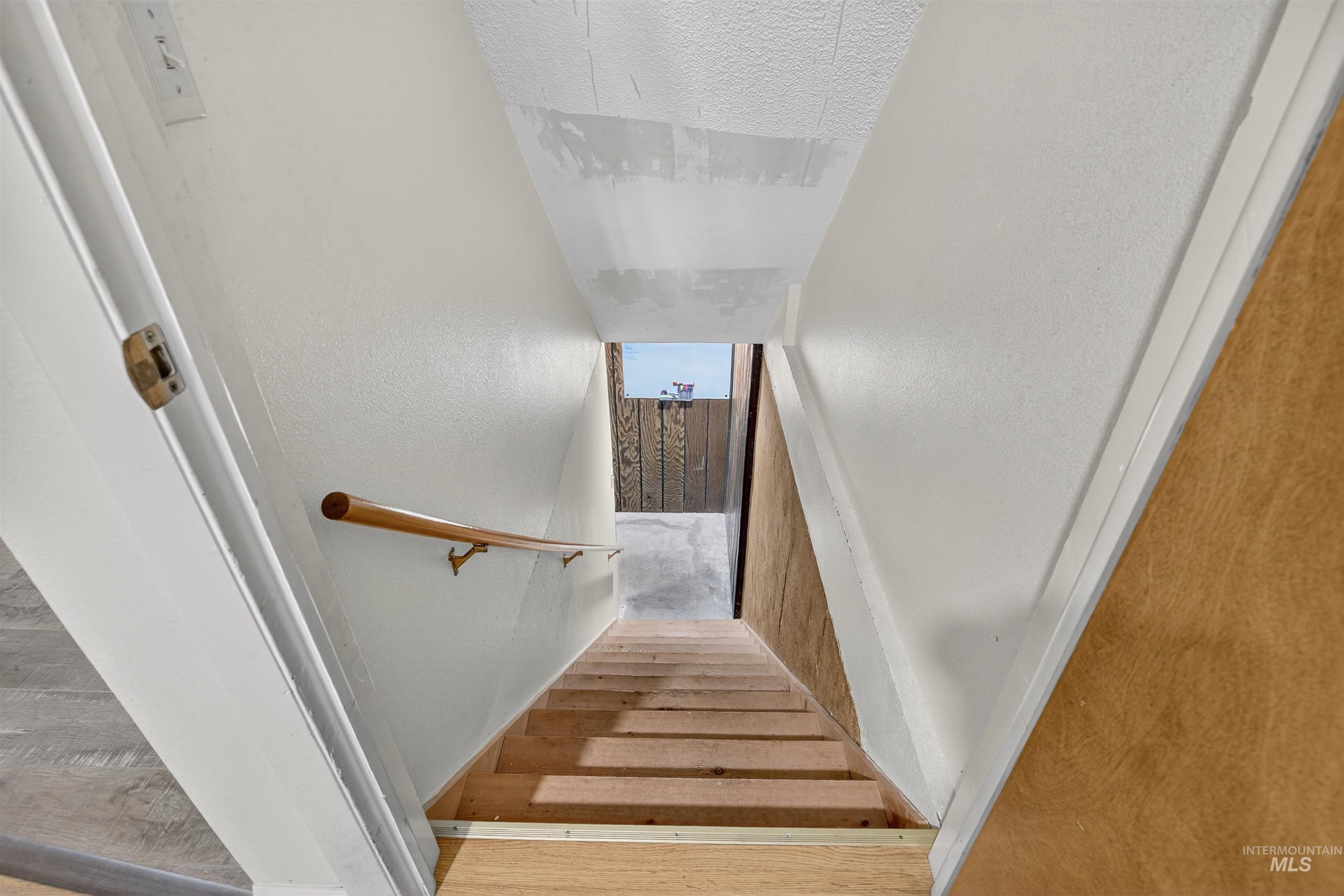 Staircase with wood finished floors