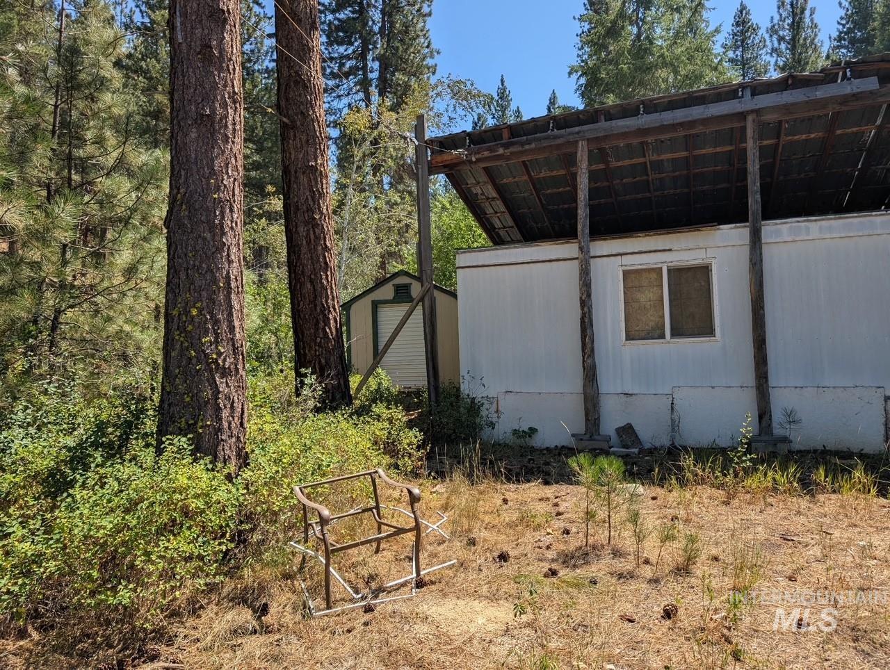 View of home's exterior with a shed