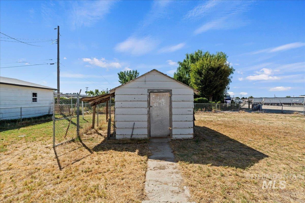 View of shed featuring a fenced backyard