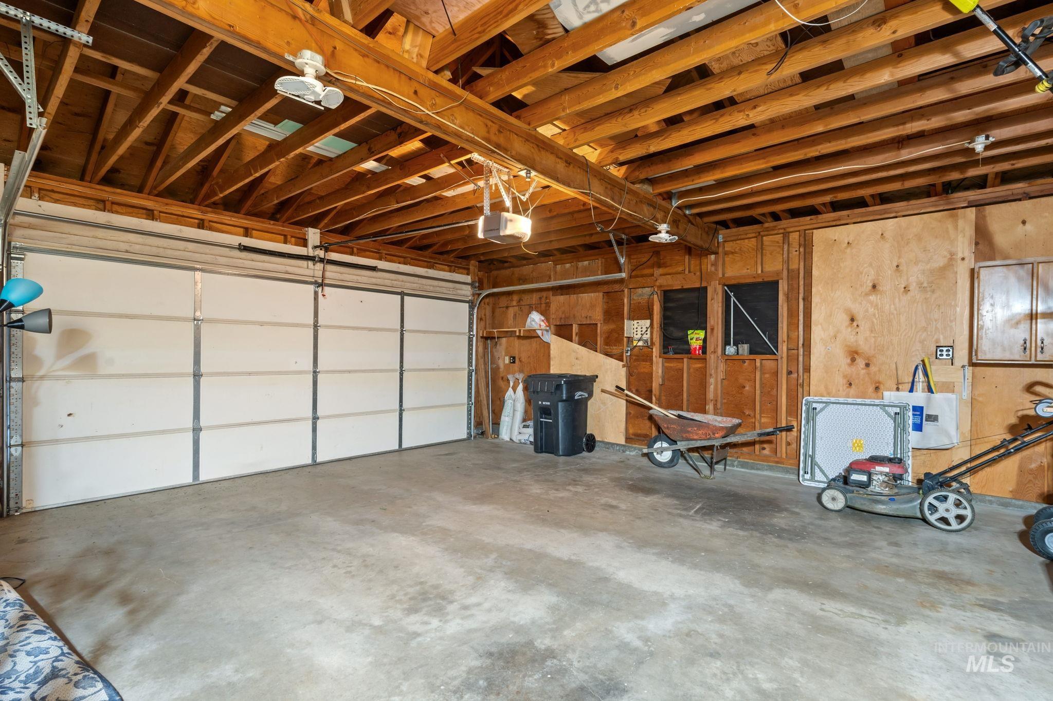 Garage featuring a garage door opener