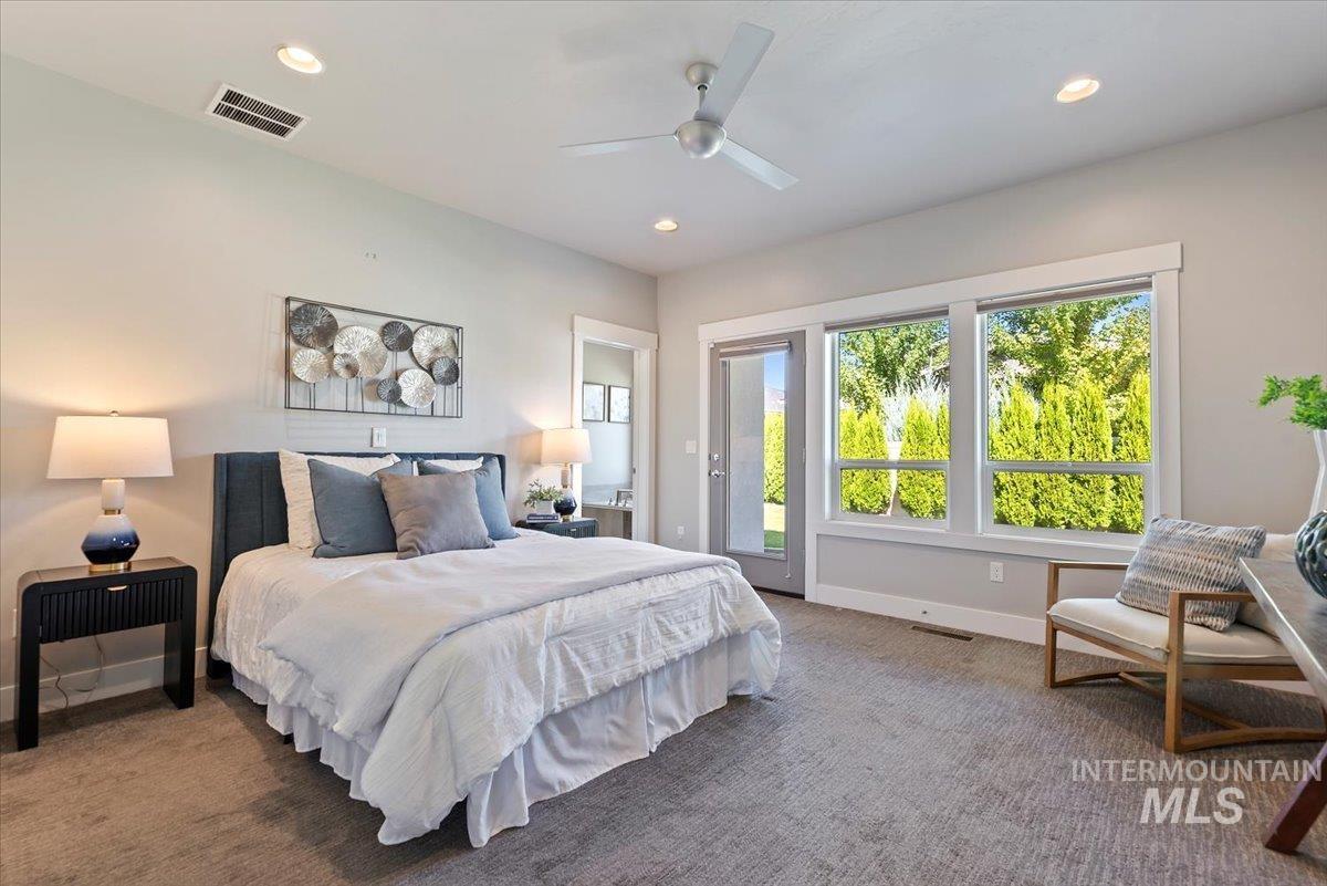 Bedroom with carpet flooring, recessed lighting, ceiling fan, and access to outside