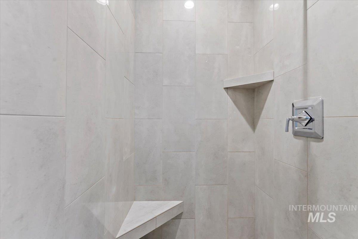 Bathroom featuring a tile shower