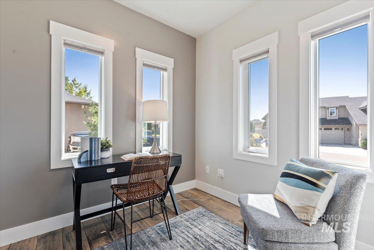 Office with baseboards and wood finished floors