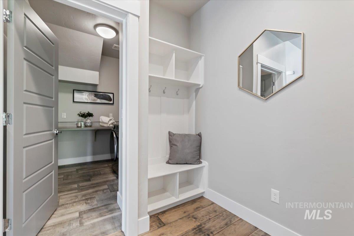 Mudroom featuring light wood-style flooring