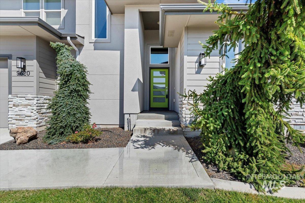 Property entrance featuring stucco siding
