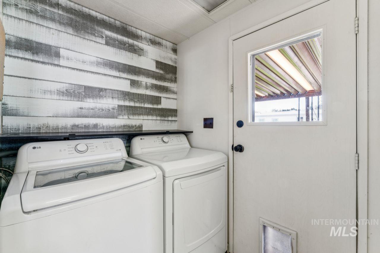 Laundry room featuring separate washer and dryer