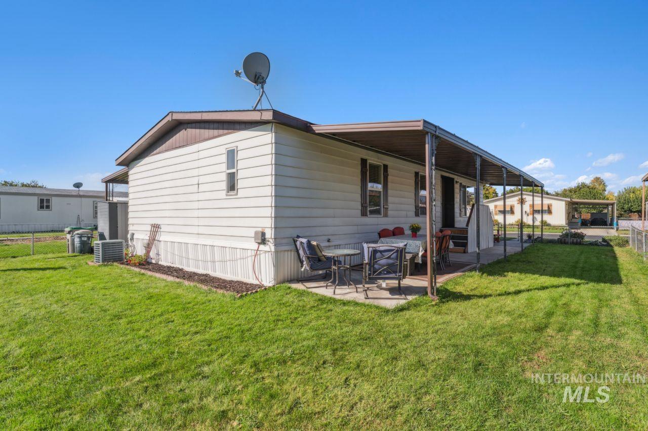 Rear view of property with a patio